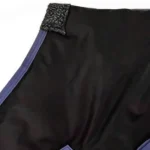 Black winter horse blanket with purple trim and textured strap detail